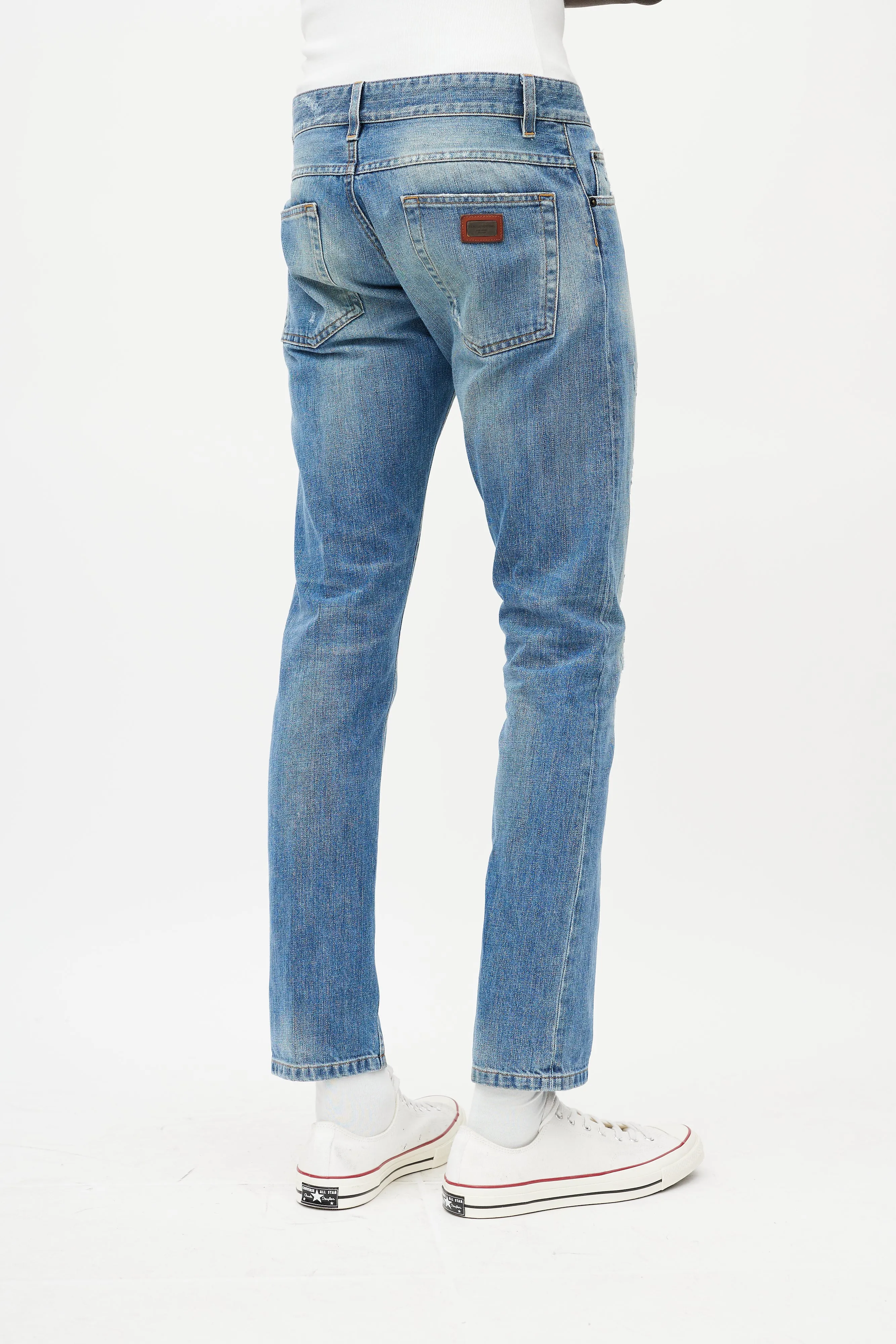 Light Wash Distressed Slim Jeans